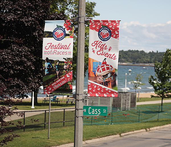 BannerSaver brackets and custom light pole banners advertising the National Cherry Festival in Traverse City, Michigan.