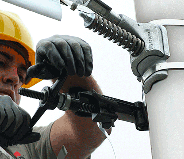 close-up shot of bannersaver bracket being installed on a light pole
