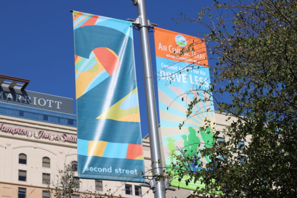 Banner Saver spring-loaded brackets and custom printed banners for an Austin, Texas event.