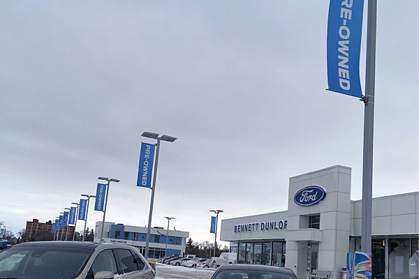 Wind Resistant Pole Banners | BannerSaver Wind Spilling Brackets