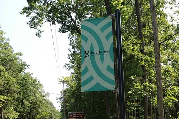 BannerSaver brackets on a lamp post outside of Interlochen Arts Academy.