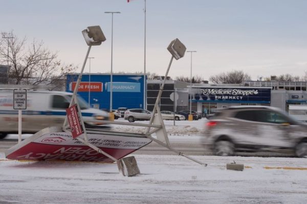 Canada Winter Storm Tipped Over Sign